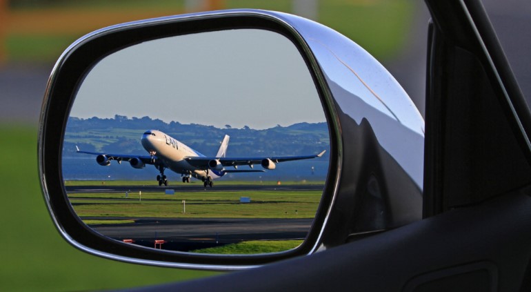 Plane in a rear view mirror
