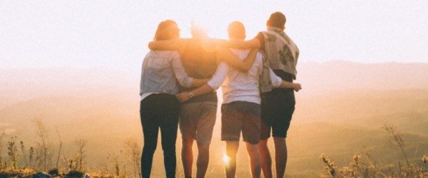 People hugging in sunlight